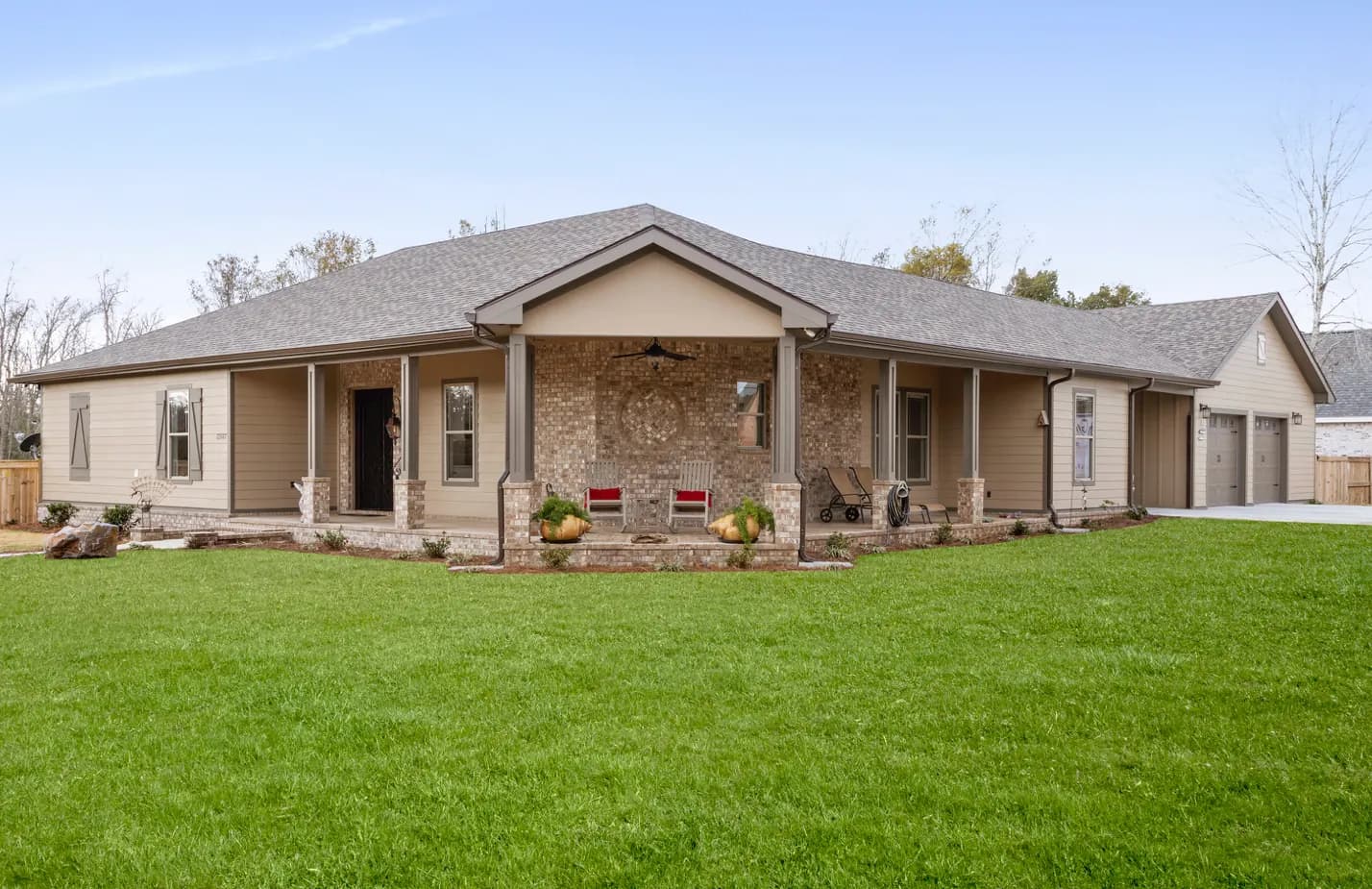 Single-story ranch home with a stone front porch built by Supreme Contractors Group in Gulfport, Mississippi